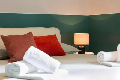 Letto o letti in una camera di A peaceful oasis by the city centre