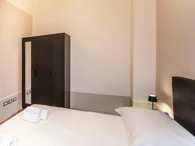 Letto o letti in una camera di [Centro] Sant’Ambrogio Flat