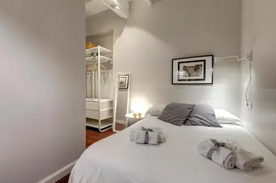 Letto o letti in una camera di Cloe Apartment by Mamo Florence