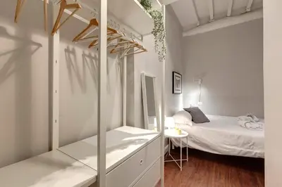 Letto o letti in una camera di Cloe Apartment by Mamo Florence