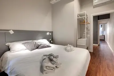 Letto o letti in una camera di Cloe Apartment by Mamo Florence