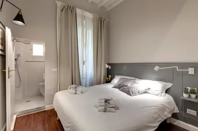 Letto o letti in una camera di Cloe Apartment by Mamo Florence