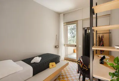 Letto o letti in una camera di 'RE-Dama Hostel