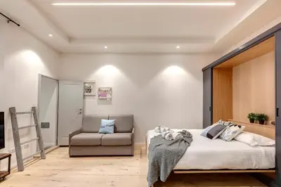 Letto o letti in una camera di Isidora Apartment by Mamo Florence
