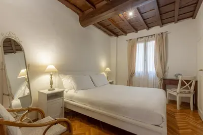 Letto o letti in una camera di Signoria Florentine Apartment