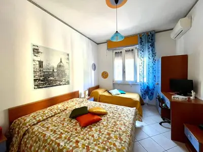 Letto o letti in una camera di Florence House Mariangela