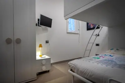 Letto o letti in una camera di Garden apartment, il tuo accogliente rifugio a Firenze