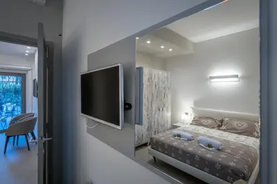 Letto o letti in una camera di Garden apartment, il tuo accogliente rifugio a Firenze