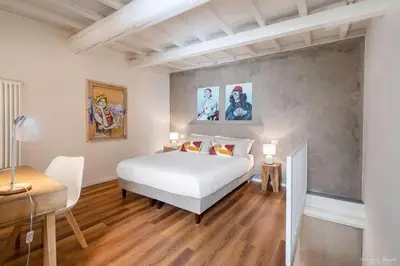 Letto o letti in una camera di FLO Florence Loft