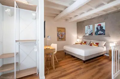 Letto o letti in una camera di FLO Florence Loft