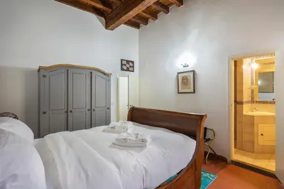 Letto o letti in una camera di Residenza Uffizi