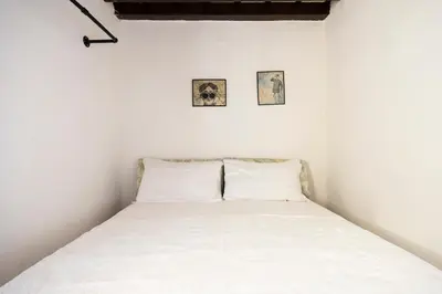Letto o letti in una camera di Ginori C