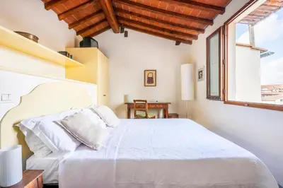 Letto o letti in una camera di Piazza Santa Croce