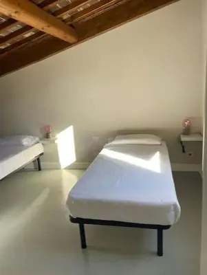 Letto o letti in una camera di Nice And Big Apartment Outside ZTL