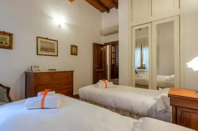 Letto o letti in una camera di Ponte Vecchio - Appartamento Oltrarno Ruby