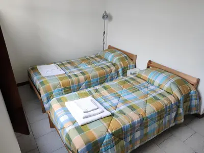 Letto o letti in una camera di MAISON VEZZANI - Careggi - 2 terrazze private, parcheggio