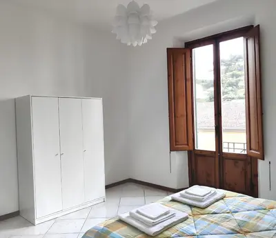 Letto o letti in una camera di MAISON VEZZANI - Careggi - 2 terrazze private, parcheggio