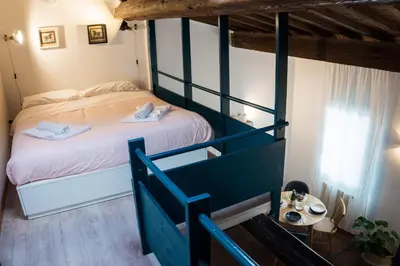 Letto o letti in una camera di Palazzuolo 118 apartments