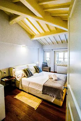 Letto o letti in una camera di Acacia Firenze - Cocco