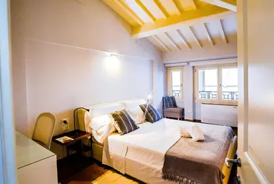 Letto o letti in una camera di Acacia Firenze - Cocco