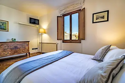 Letto o letti in una camera di YID VELLUTINI