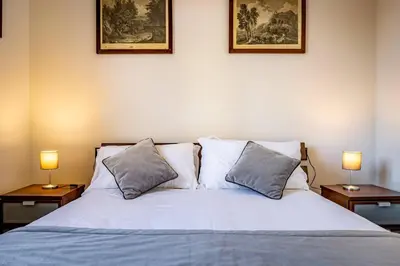 Letto o letti in una camera di YID VELLUTINI