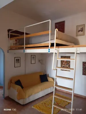 Letto o letti in una camera di Casa Irma Confortevole appartamento nel cetro di prato