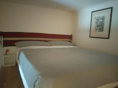 Letto o letti in una camera di Casa Irma Confortevole appartamento nel cetro di prato