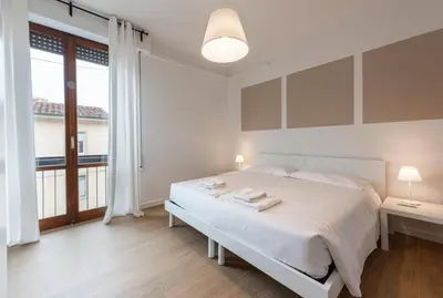 Letto o letti in una camera di Rosselli by Mmega