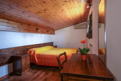 Letto o letti in una camera di Agriturismo Michelangelo