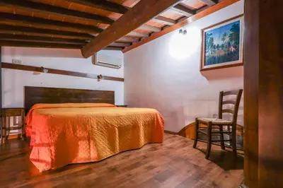 Letto o letti in una camera di Agriturismo Michelangelo