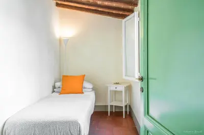 Letto o letti in una camera di Wine Apartments Florence Lambrusco