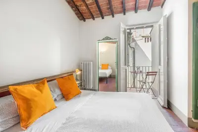 Letto o letti in una camera di Wine Apartments Florence Lambrusco