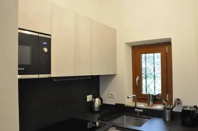 Cucina o angolo cottura di CHARMING APARTMENT MICHELANGELO