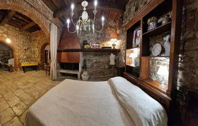 Letto o letti in una camera di IL POZZO DEI DESIDERI FIRENZE
