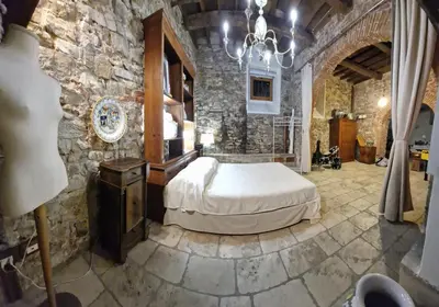 Letto o letti in una camera di IL POZZO DEI DESIDERI FIRENZE
