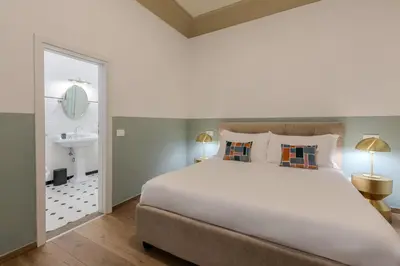 Letto o letti in una camera di B&B Stanze Guelfe
