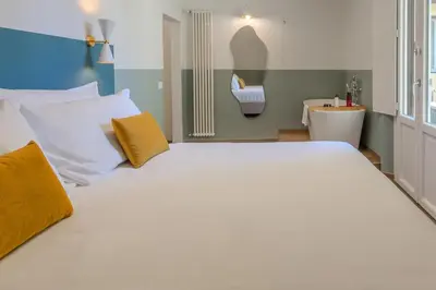 Letto o letti in una camera di B&B Stanze Guelfe