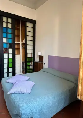 Letto o letti in una camera di Soffiano Flat Firenze - Charming Italy Tour