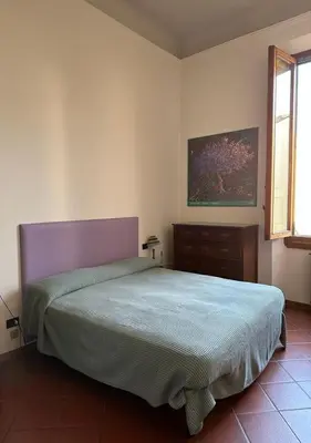 Letto o letti in una camera di Soffiano Flat Firenze - Charming Italy Tour