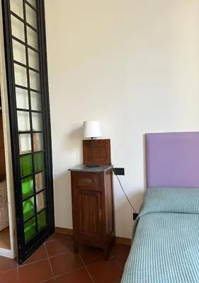Letto o letti in una camera di Soffiano Flat Firenze - Charming Italy Tour