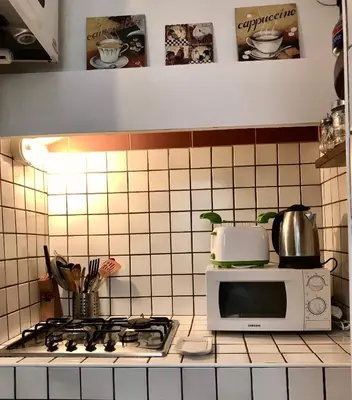 Cucina o angolo cottura di Classico e romantico Appartamento Fiorentino 10 min a piedi da Ponte Vecchio e 5 minuti da Palazzo Pitti area UNESCO