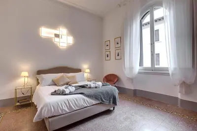 Letto o letti in una camera di Magenta Apartment by Mamo Florence