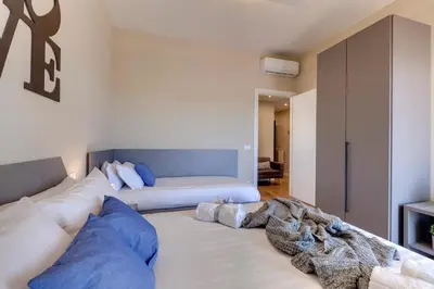 Letto o letti in una camera di Khione Apartment by Mamo Florence