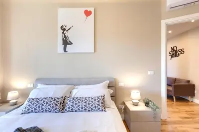Letto o letti in una camera di Khione Apartment by Mamo Florence