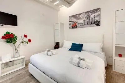 Letto o letti in una camera di Cristofano Studio by Mamo Florence