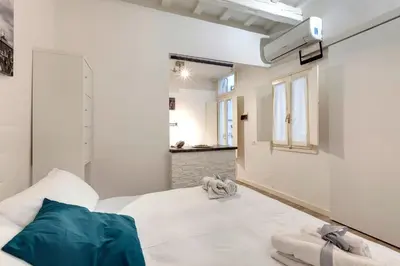 Letto o letti in una camera di Cristofano Studio by Mamo Florence