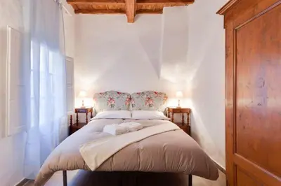 Letto o letti in una camera di Medici Florence Tower Apartment