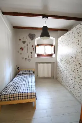 Letto o letti in una camera di Casa Margherita