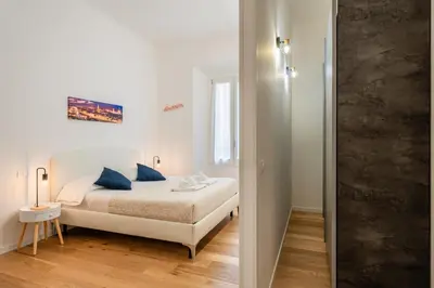 Letto o letti in una camera di The World Apartment
